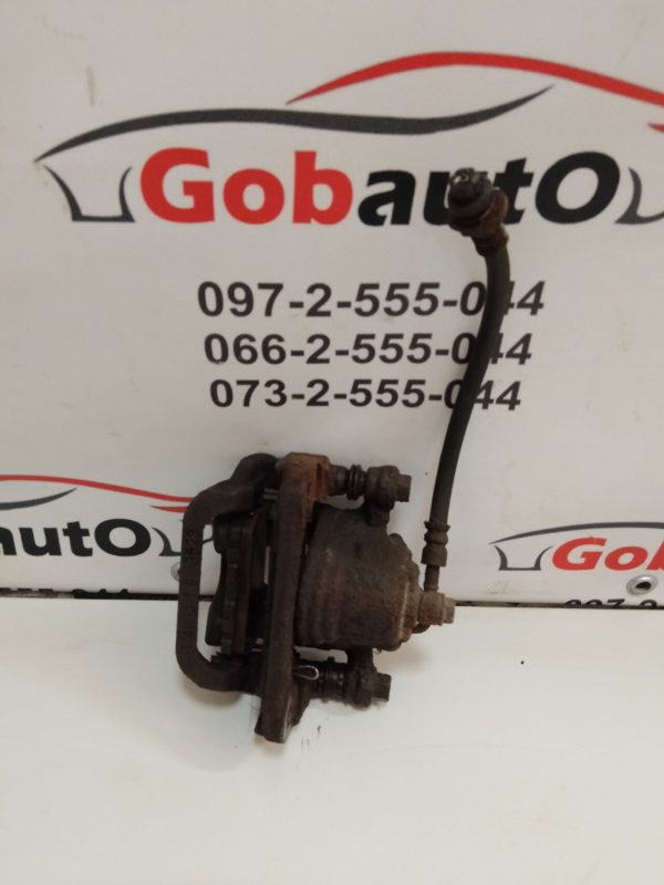 Б/У Суппорт задній правий NISSAN QASHQAI J10  44001EM11A